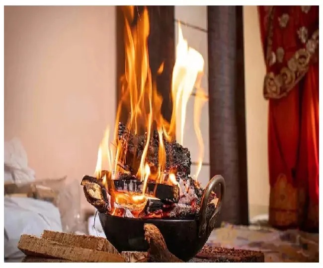 Traditional Hindu pooja with diya lamps